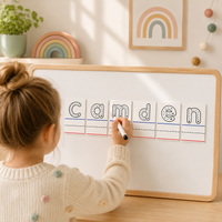 Child practicing handwriting on a personalized name tracing magnet with reusable dry erase letters for preschool, kindergarten, homeschool and early learning.